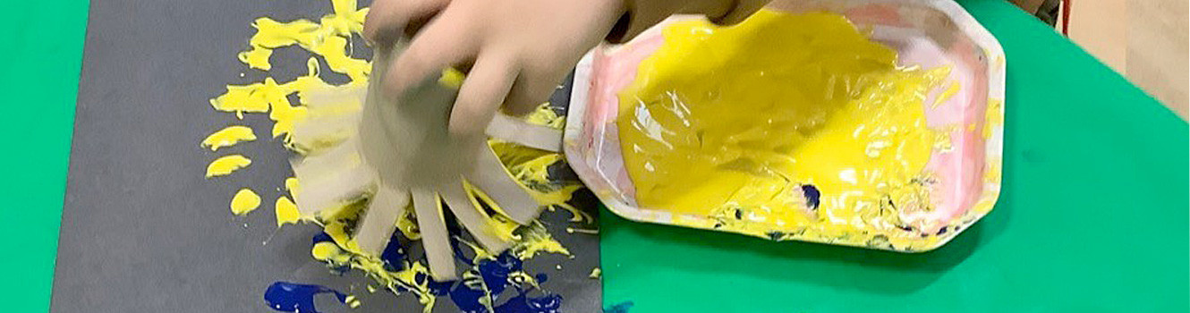 One of the children making a firework painting