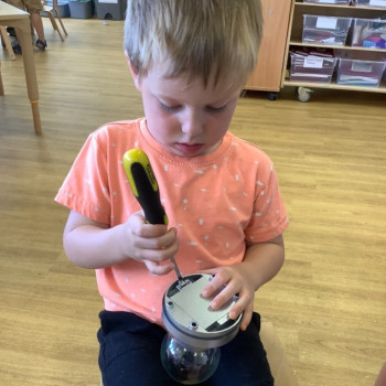Boy fixing a toy light