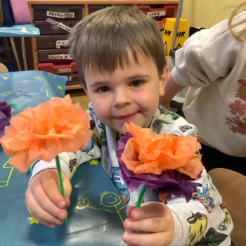 Boy with paper flowers 