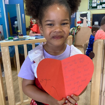 Girl with a heart card
