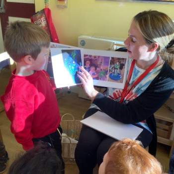Child and teacher reading