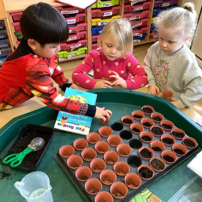 children planting seeds