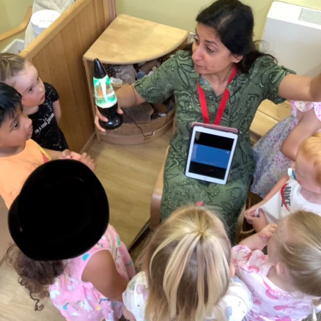 Children in a group listening to a talk