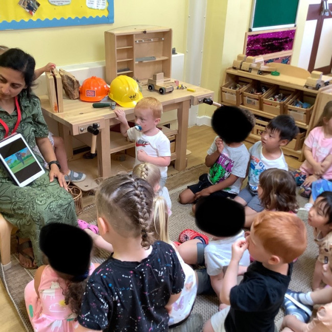 Children in a group listening to a talk