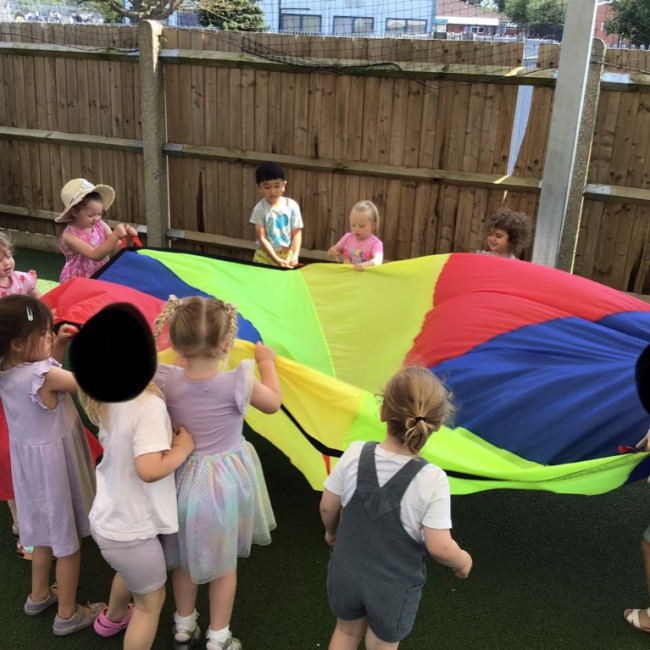 Children playing with a parachute