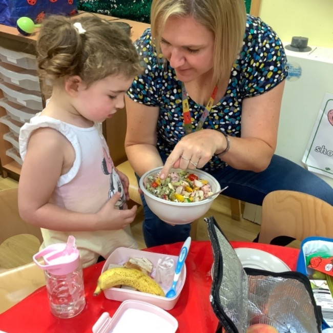 Child playing with a teacher