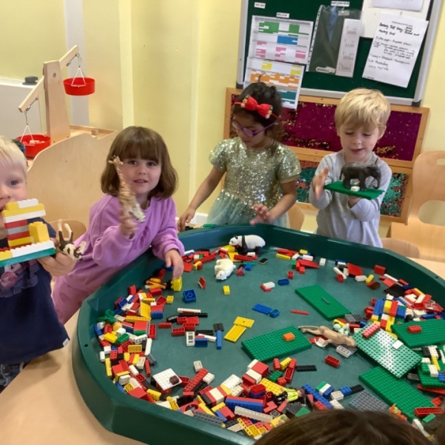 Child paying with Lego