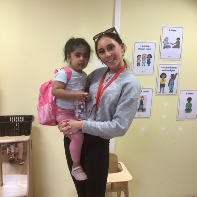 Child with their teacher