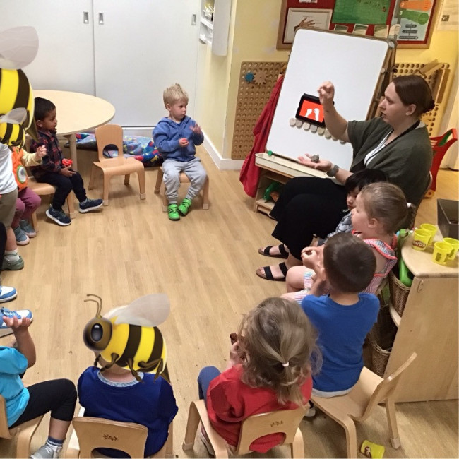 Children listening to a teacher