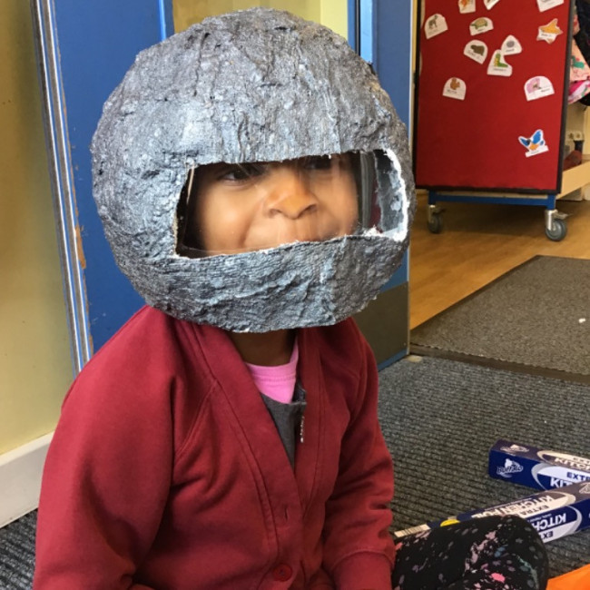 Child with a space helmet