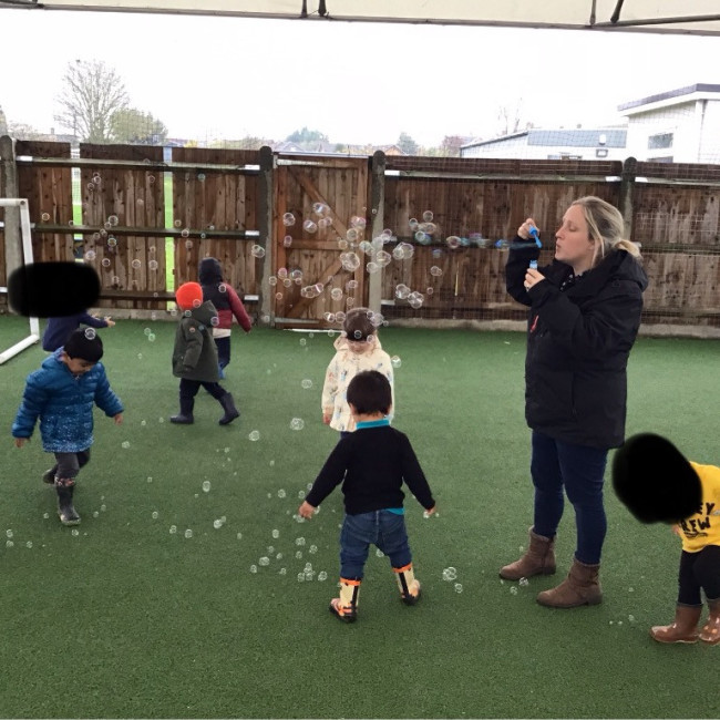 Children blowing bubbles