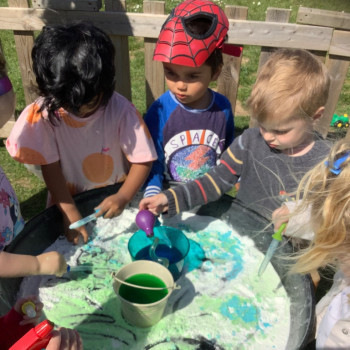Children playing with Mini beasts