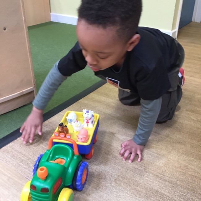 Child playing with a toy. 