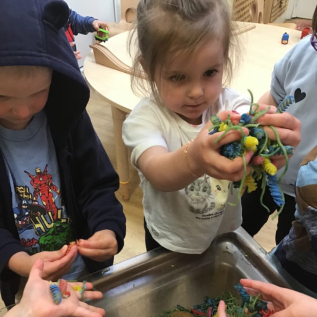 Children playing with Play Doh. 