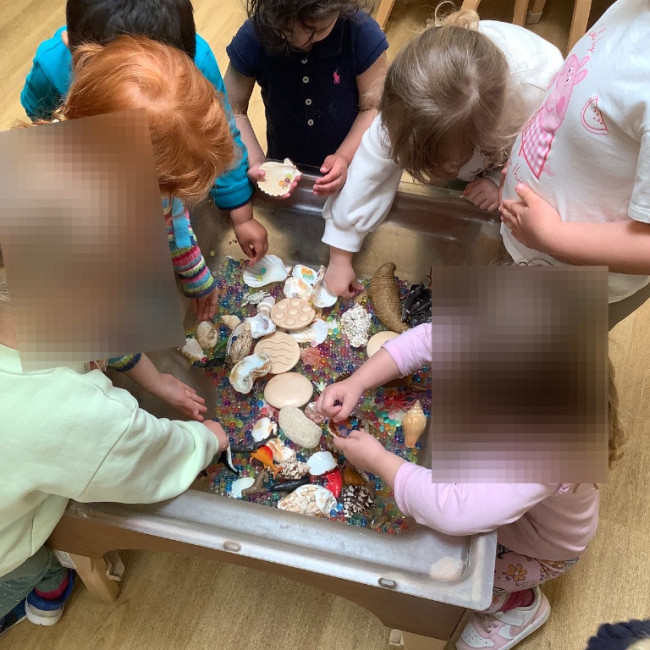 Children playing with the tactile objects. 