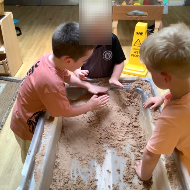 Playing in a sand pit. 