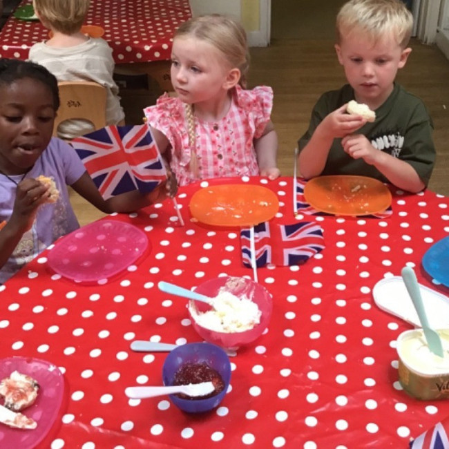 Children eating scones. 