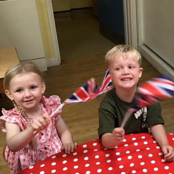 Children waving some flags. 