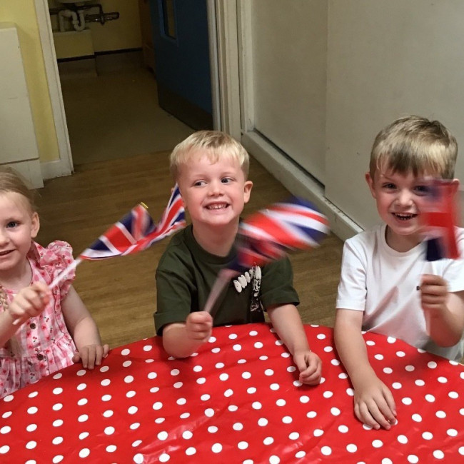 Children waving flags. 