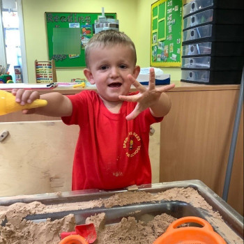 A child holding out his hands 