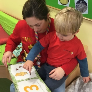 Sophie reading with a child.